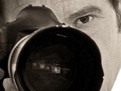 Claudio Carlos Basso is posing like he is using the camera.